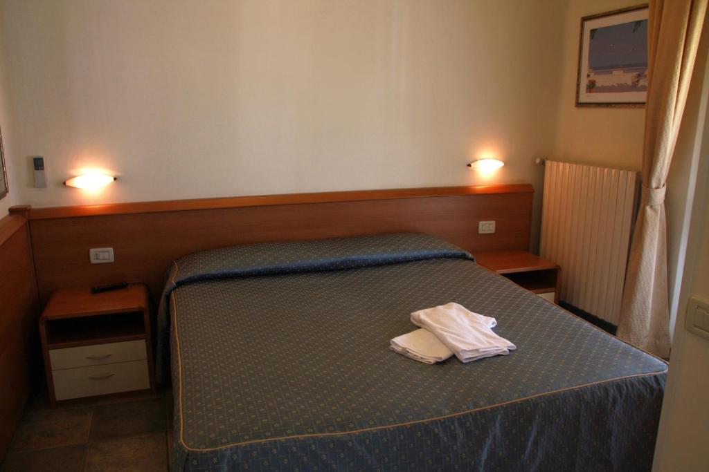 Postel nebo postele na pokoji v ubytování Hotel Angela