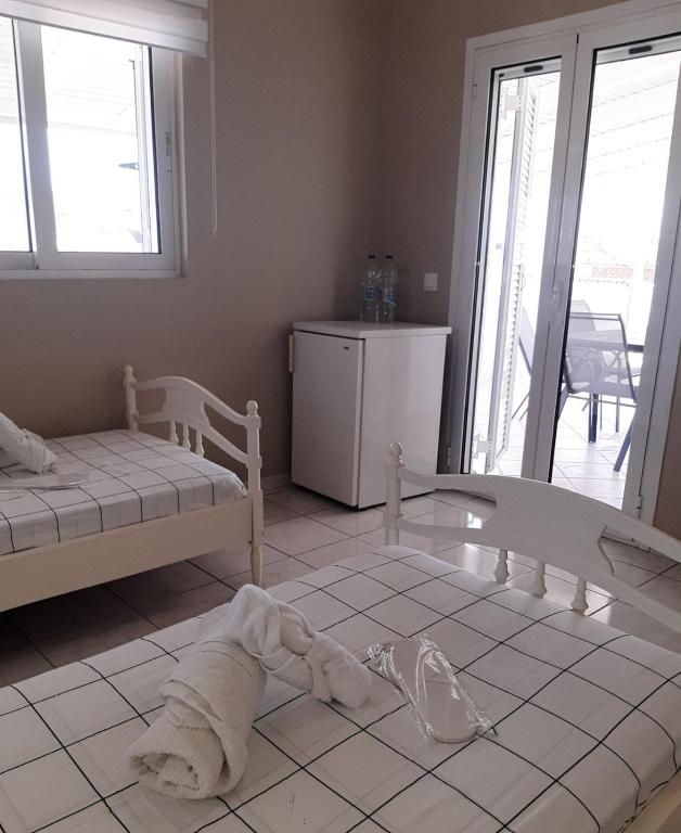 A bed or beds in a room at Super renovated maisonette - Σούπερ ανακαινισμένη μεζονέτα