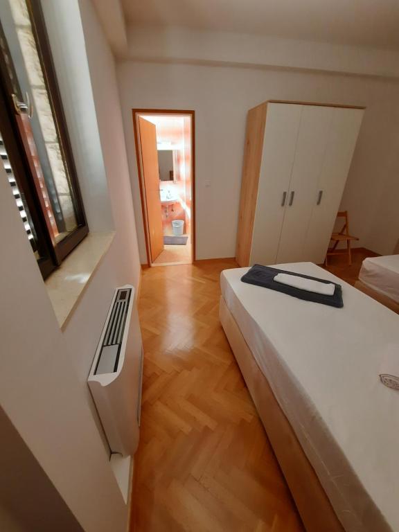 Postel nebo postele na pokoji v ubytování Pansion Drvo