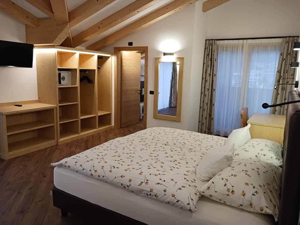 A bed or beds in a room at La Campagnola
