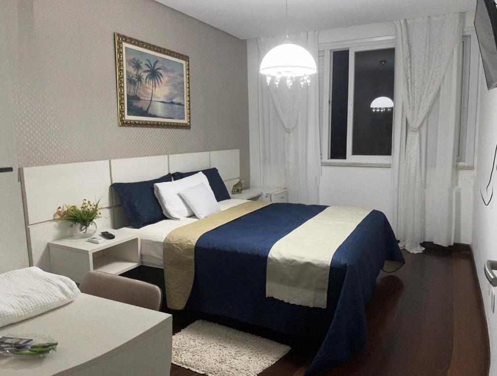 Postel nebo postele na pokoji v ubytování Hospedagem no Farol da Barra