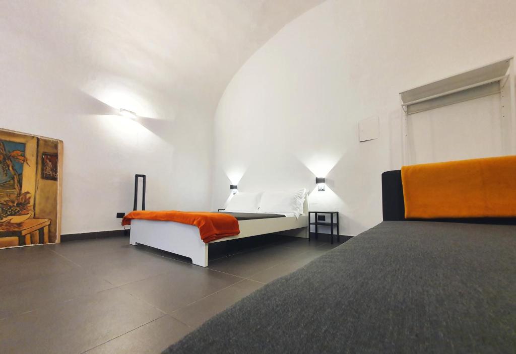 a bedroom with two beds in a room at La Casa dell'Artista nel centro storico - La Spezia in La Spezia