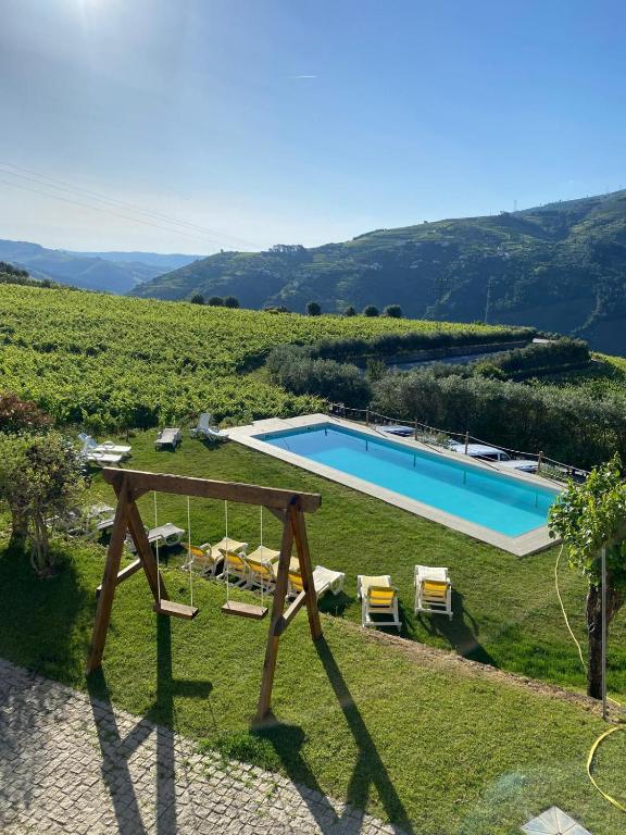 a villa with a swimming pool in a vineyard at 44House - Quinta do Casal in Mesão Frio