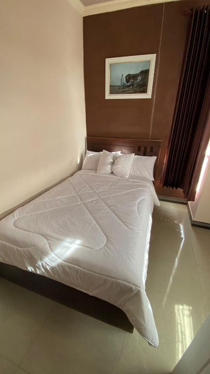 Postel nebo postele na pokoji v ubytování gigafa homestay