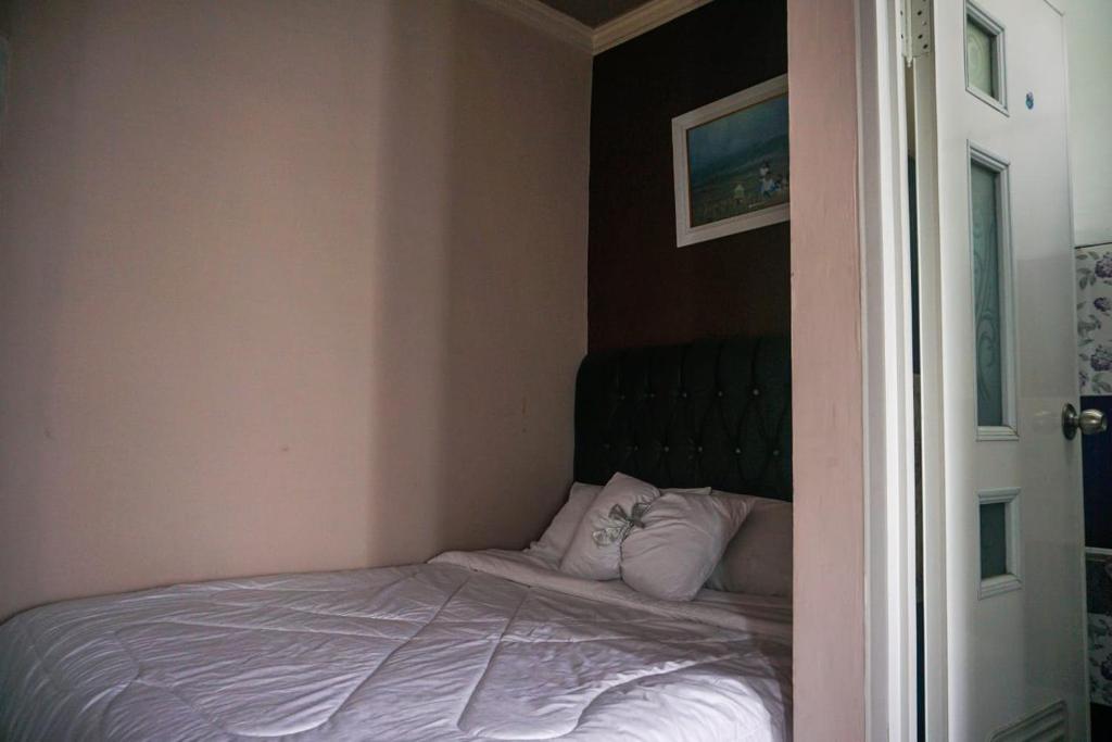 Postel nebo postele na pokoji v ubytování gigafa homestay