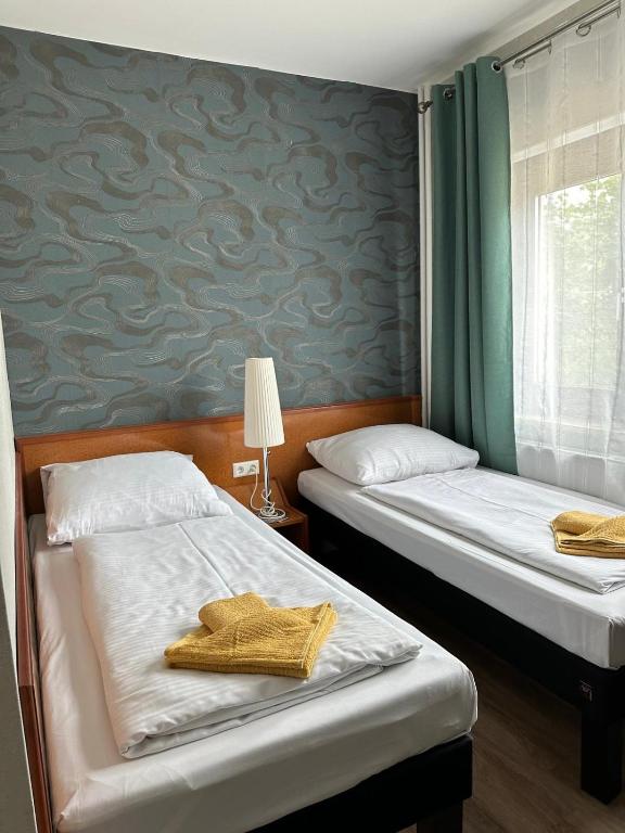 Postel nebo postele na pokoji v ubytování Hotel Pirol