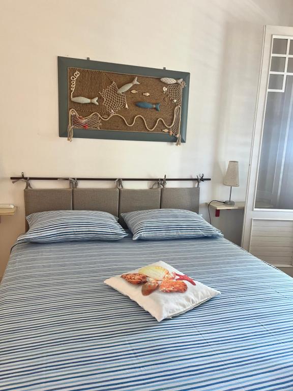 Postel nebo postele na pokoji v ubytování Casa vacanze “Ficupala”