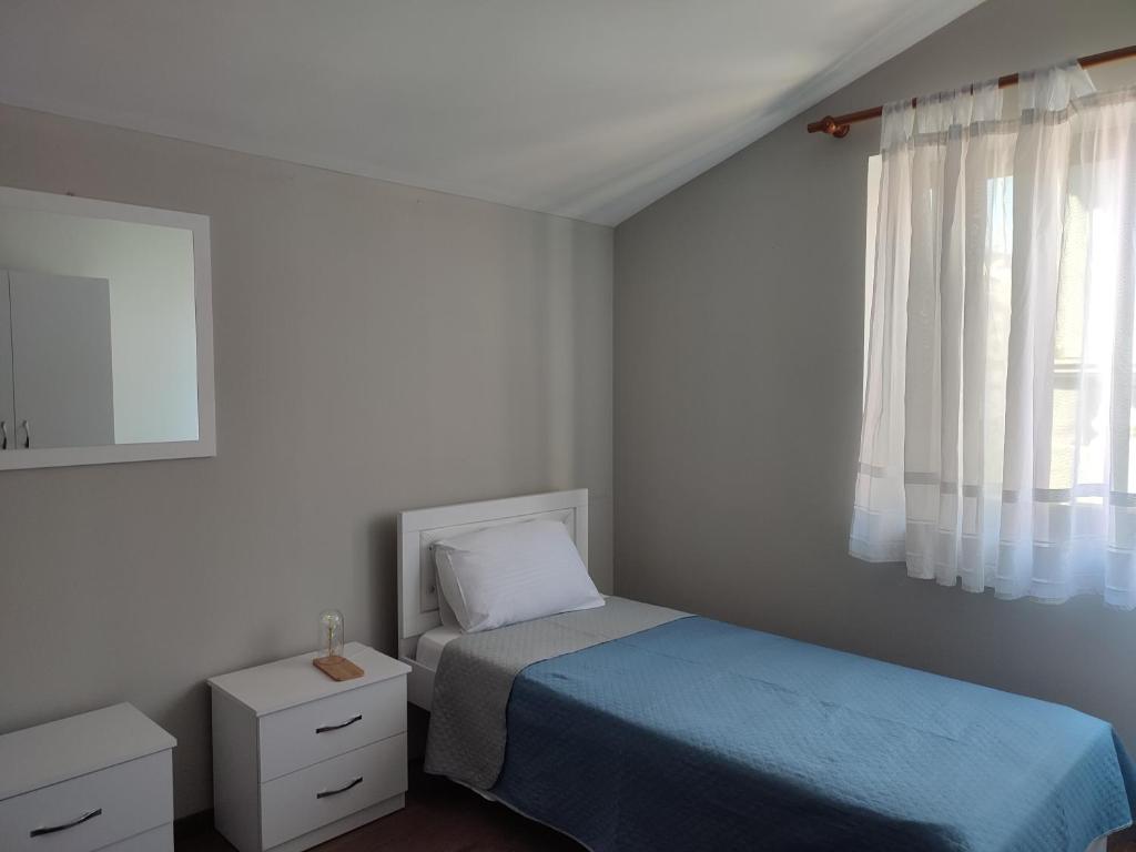 Postel nebo postele na pokoji v ubytování Rooms Xani