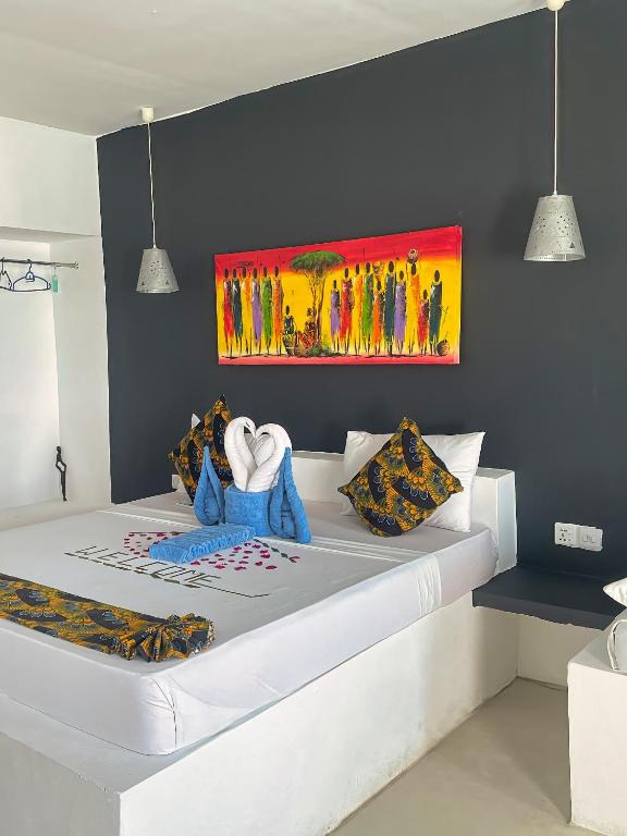 Postel nebo postele na pokoji v ubytování AVO Boutique Hotel
