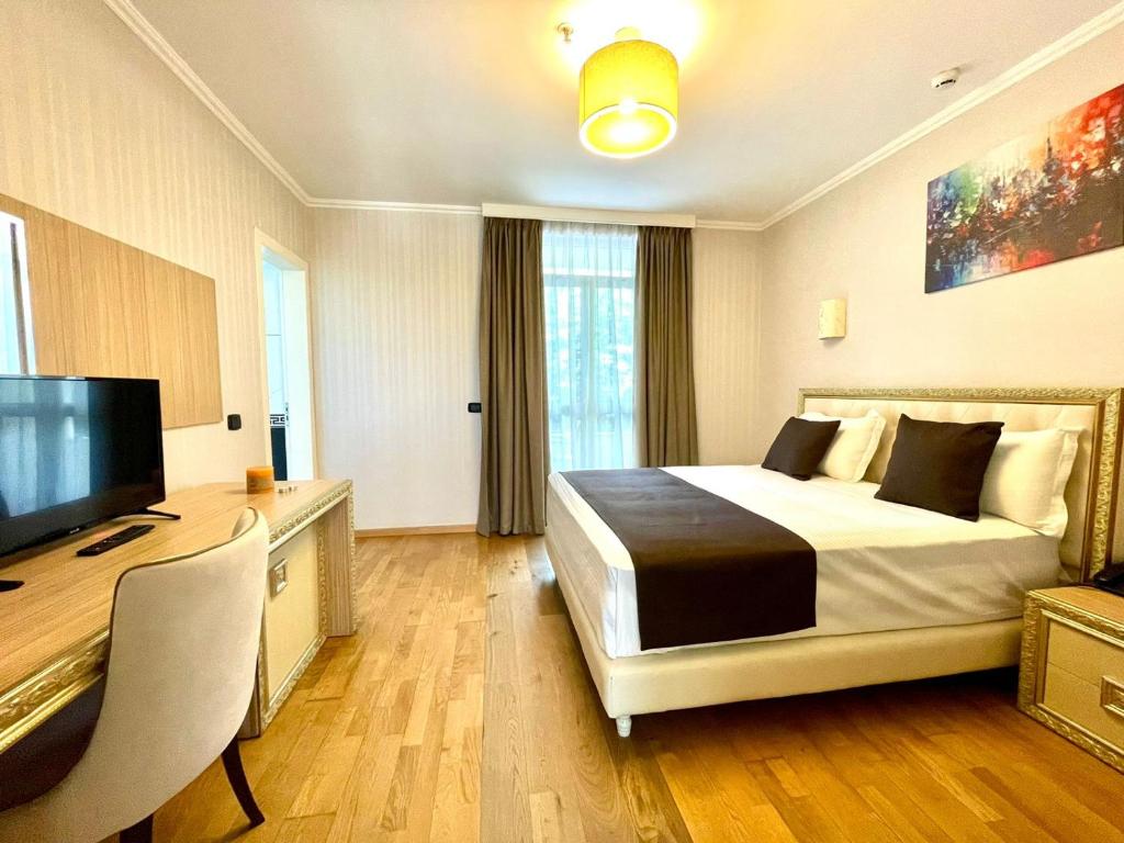 Postel nebo postele na pokoji v ubytování AMH Hotel Durres