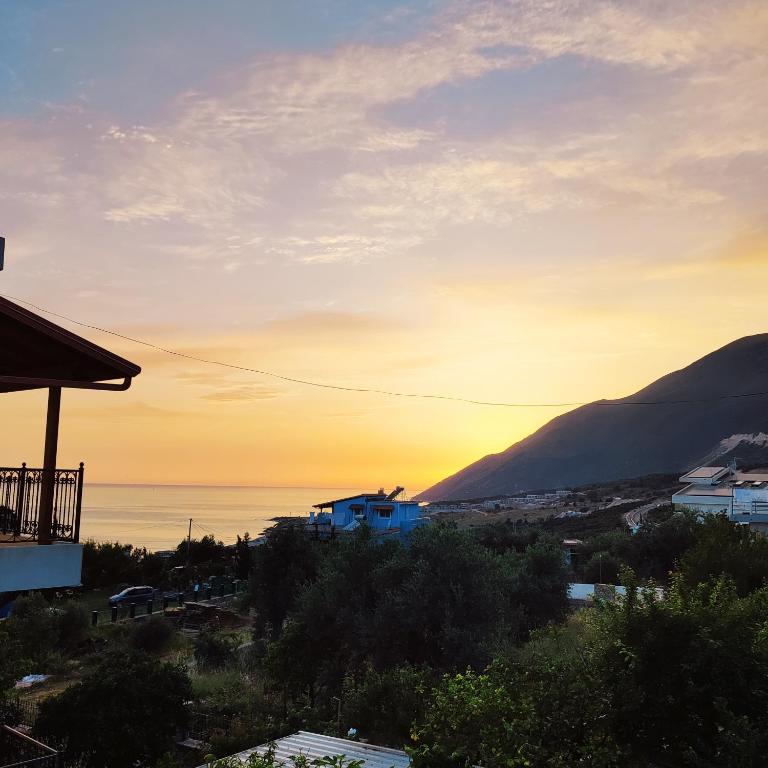 a view of the sunset from a house at Villa Janilla in Dhërmi