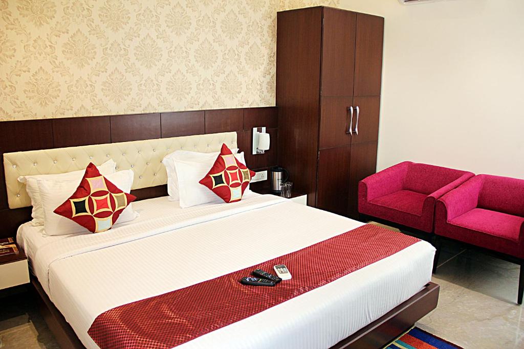 Postel nebo postele na pokoji v ubytování Hotel Taj Heights