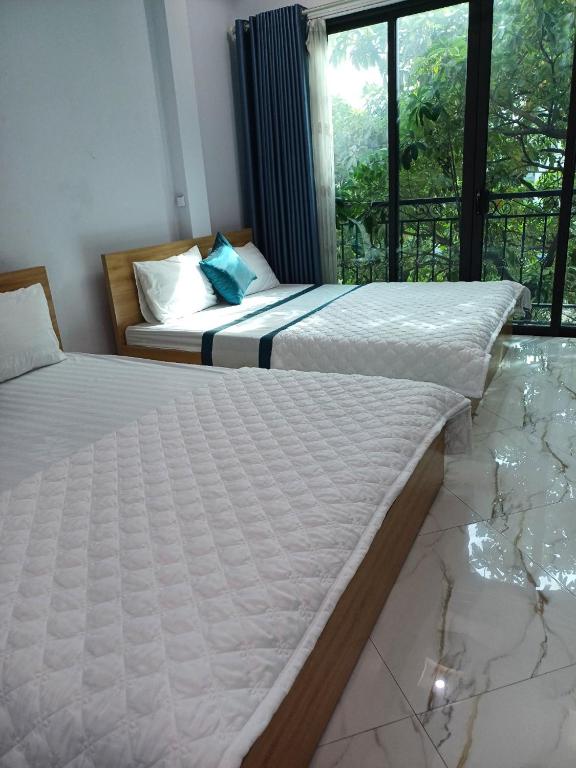 Postel nebo postele na pokoji v ubytování Hotel Hoa Ban Hà Nội