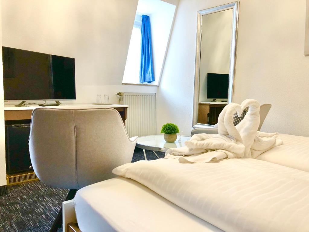 Postel nebo postele na pokoji v ubytování Hotel Garni "Brauerei Keller"