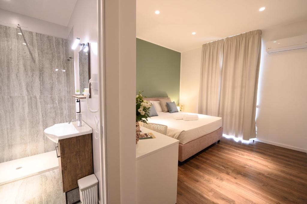 Postel nebo postele na pokoji v ubytování Baitan Hotel