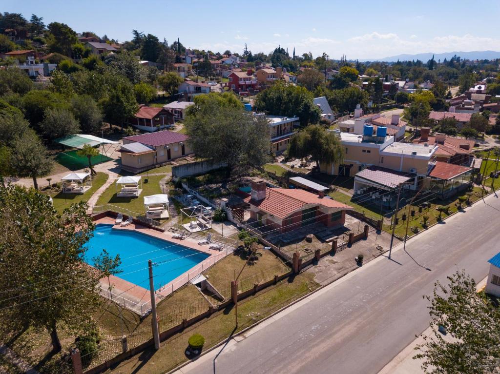 an aerial view of a town with a swimming pool at La Martinica in Villa Carlos Paz
