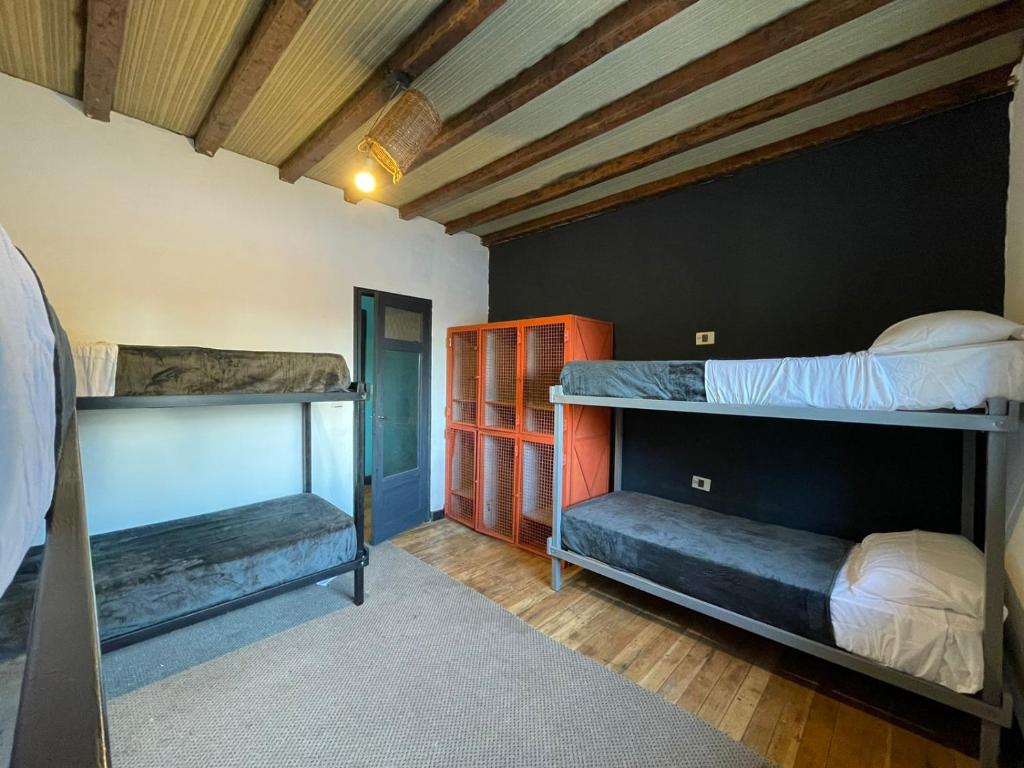 Postel nebo postele na pokoji v ubytování Hostel Punto Patagónico Bariloche