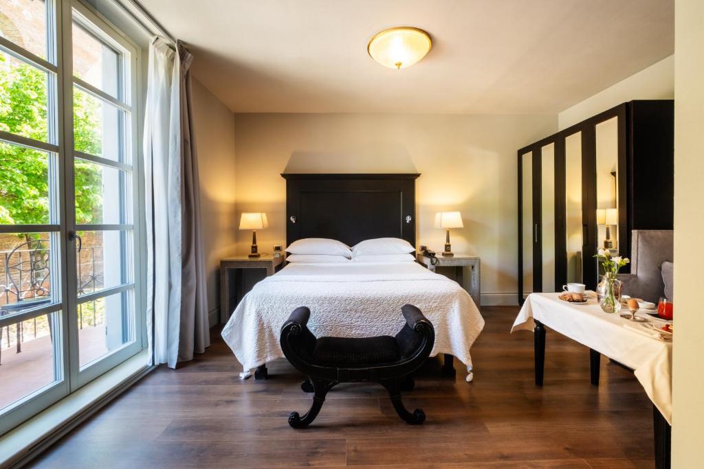 Postel nebo postele na pokoji v ubytování Hotel Vannucci