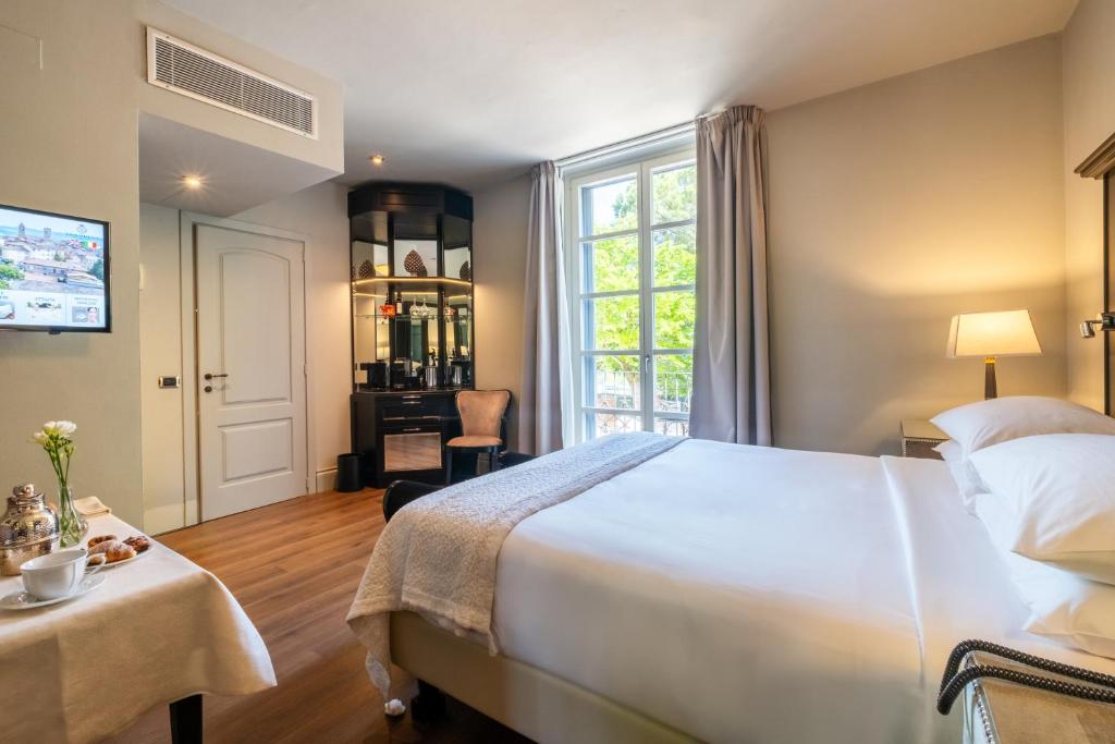 Postel nebo postele na pokoji v ubytování Hotel Vannucci