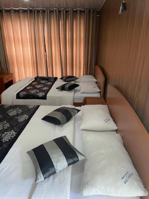 Postel nebo postele na pokoji v ubytování New Happy inn