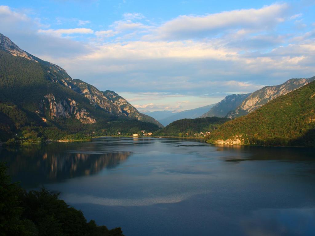 a lake in the middle of a mountain range at Villa Regina - Lake Ledro Apartments in Ledro
