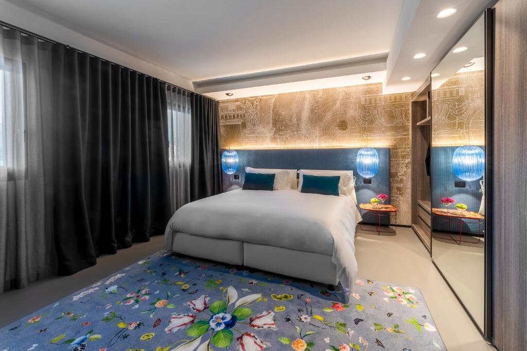 Postel nebo postele na pokoji v ubytování Hotel Doriguzzi