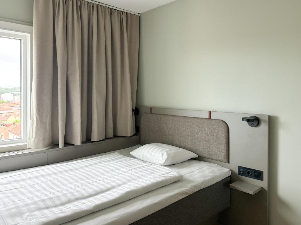 Postel nebo postele na pokoji v ubytování Comfort Hotel Panorama