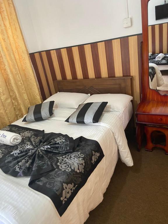 Postel nebo postele na pokoji v ubytování New Happy inn
