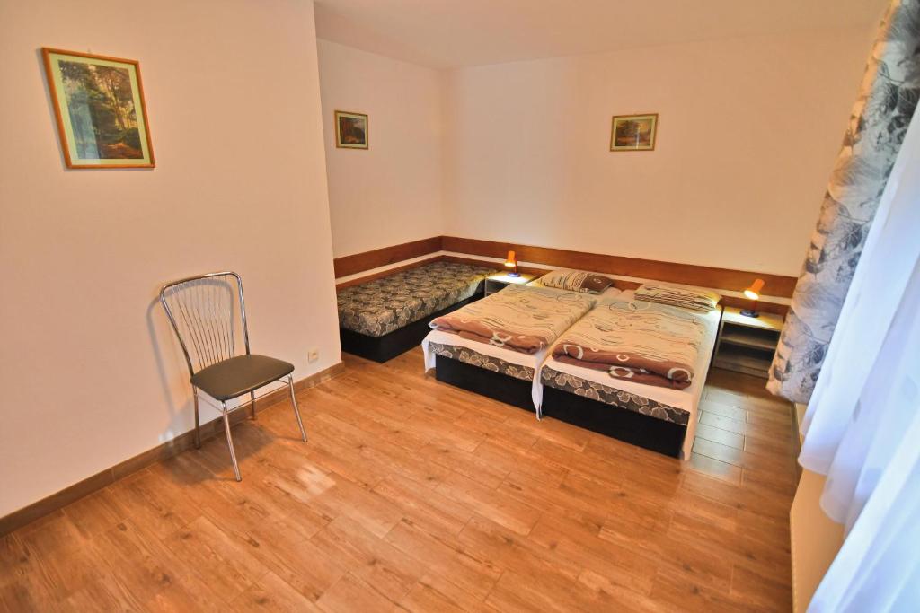 Postel nebo postele na pokoji v ubytování Penzión Hôrka