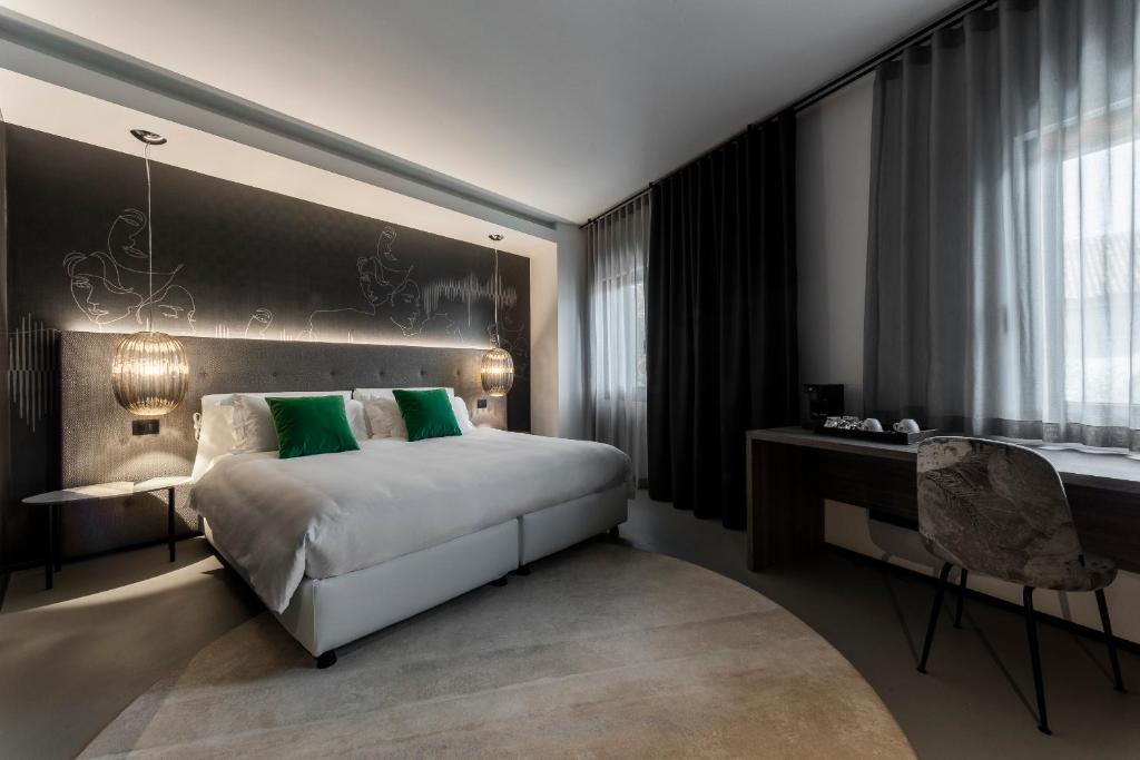 Postel nebo postele na pokoji v ubytování Hotel Doriguzzi