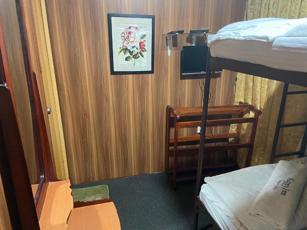 Postel nebo postele na pokoji v ubytování New Happy inn