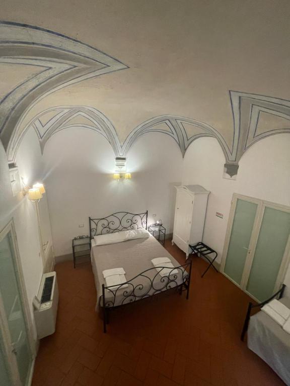 Postel nebo postele na pokoji v ubytování BonConvento Guesthouse - HiTuscany