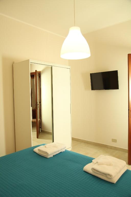Postel nebo postele na pokoji v ubytování Casa A Riba U Mari