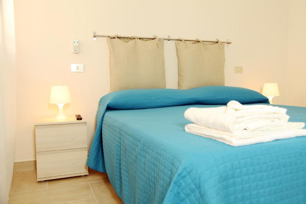 Postel nebo postele na pokoji v ubytování Casa A Riba U Mari
