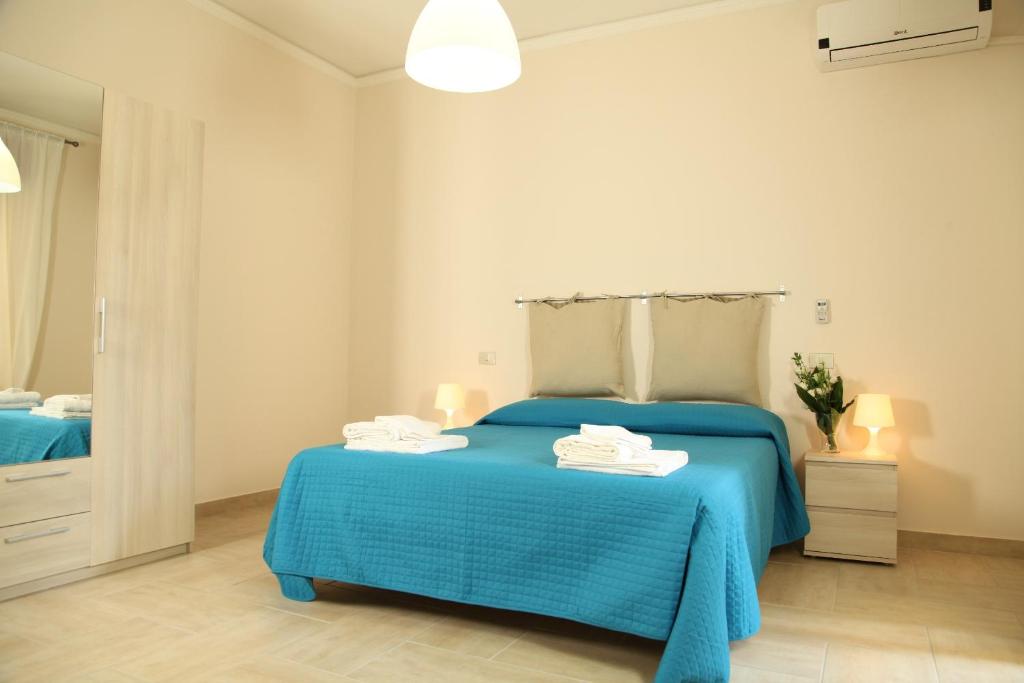 Postel nebo postele na pokoji v ubytování Casa A Riba U Mari