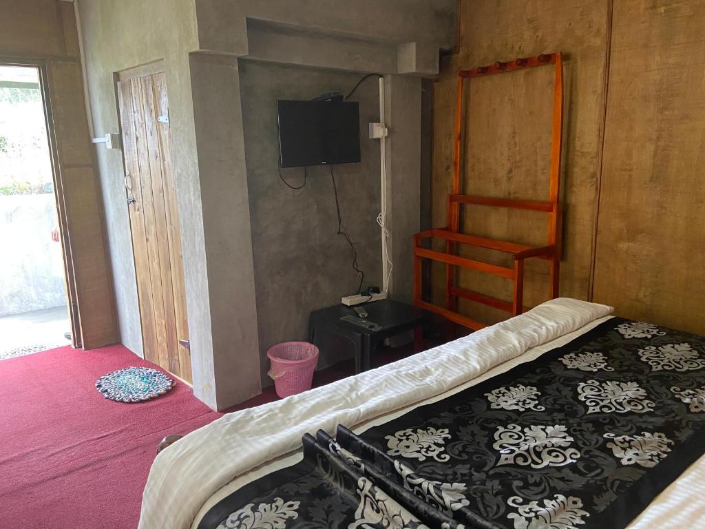 Postel nebo postele na pokoji v ubytování New Happy inn