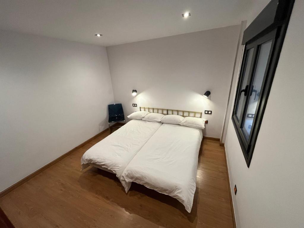 Postel nebo postele na pokoji v ubytování Lotila Flats Cabañaquinta