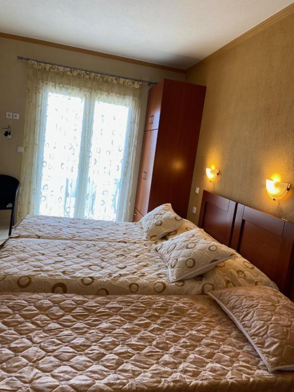 Ένα ή περισσότερα κρεβάτια σε δωμάτιο στο Diana studios