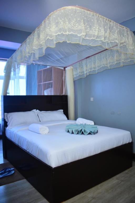 Postel nebo postele na pokoji v ubytování BRIMAK HOTEL