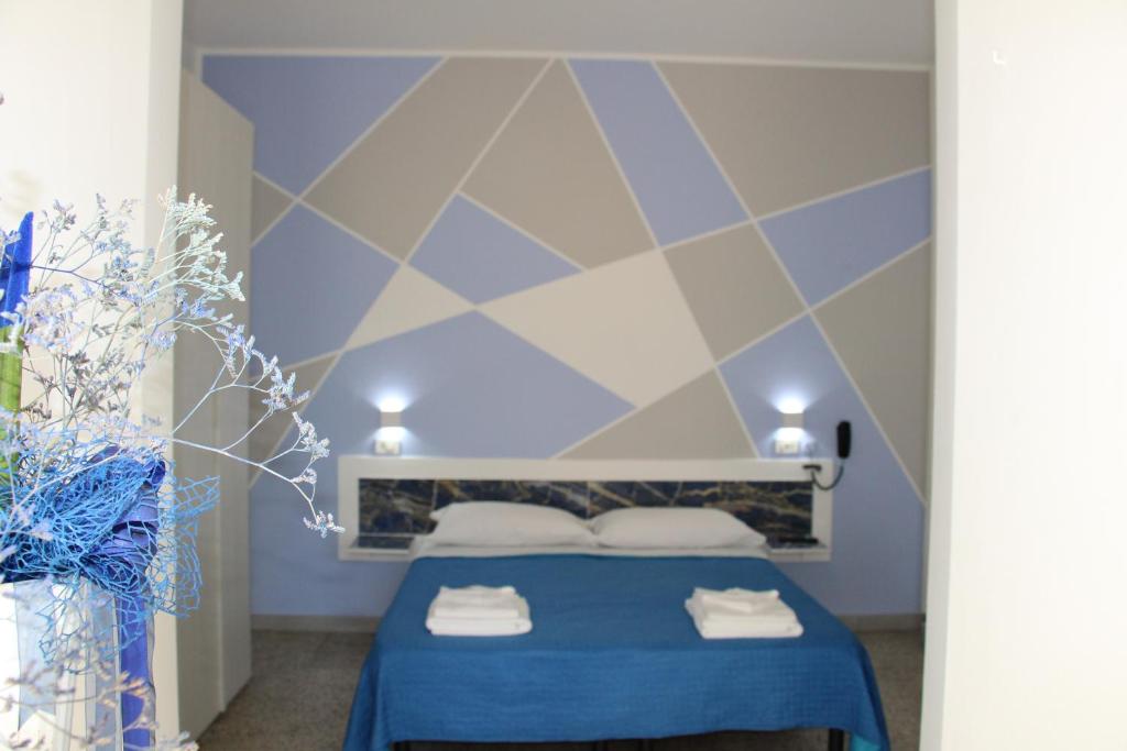 Postel nebo postele na pokoji v ubytování Martina's Hotel