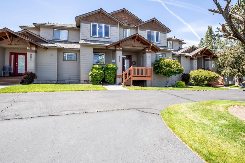 a house with a driveway in front of it at Spacious 4BR Private HOT TUB Eagle Crest Resort on Golf Course in Redmond