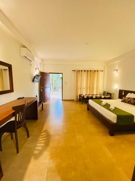 Postel nebo postele na pokoji v ubytování Tropicara Resort