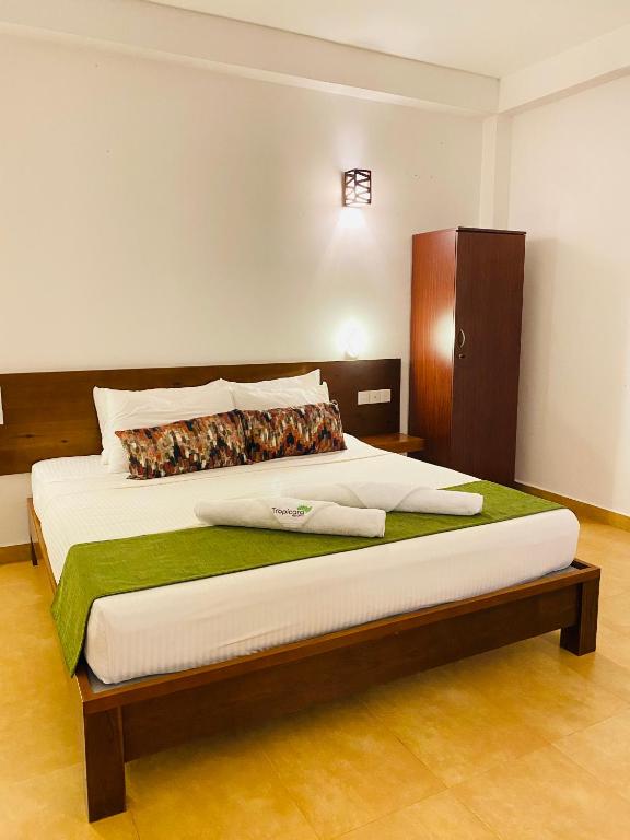 Postel nebo postele na pokoji v ubytování Tropicara Resort