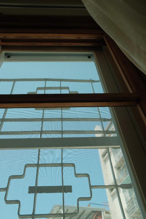 a glass window with a view of the sky at Maru in Tainan