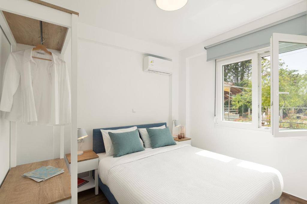 Postel nebo postele na pokoji v ubytování Anastasia Residential Complex