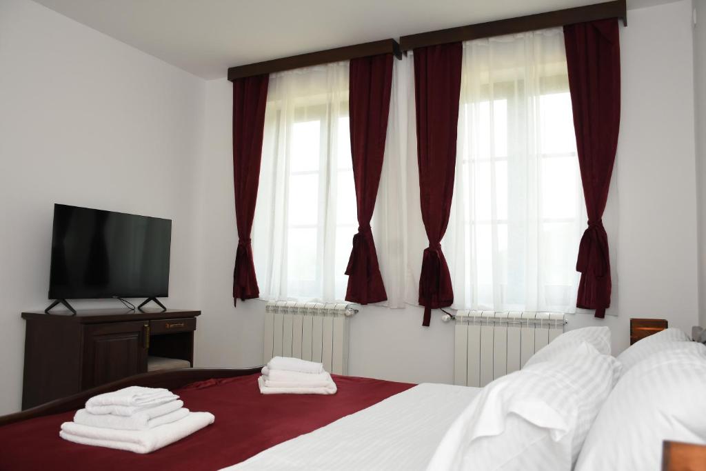 Postel nebo postele na pokoji v ubytování Kod Bogdanovica