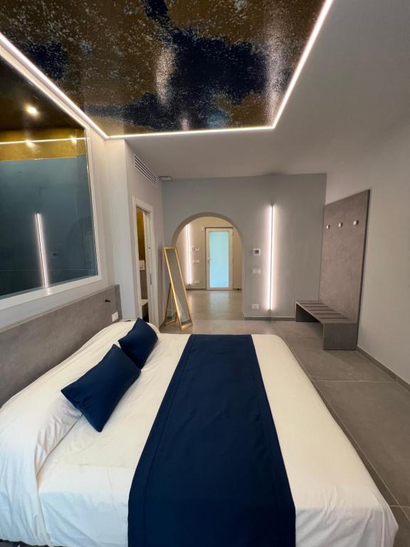 Postel nebo postele na pokoji v ubytování Shanti Rooms & Apartments Lucullo