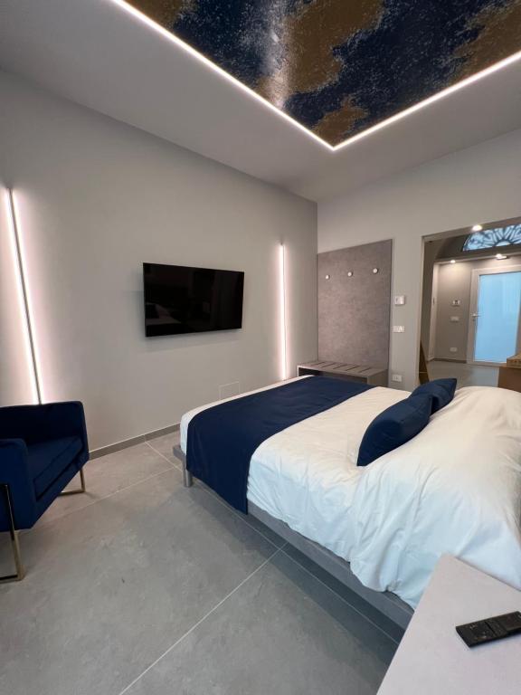 Postel nebo postele na pokoji v ubytování Shanti Rooms & Apartments Lucullo