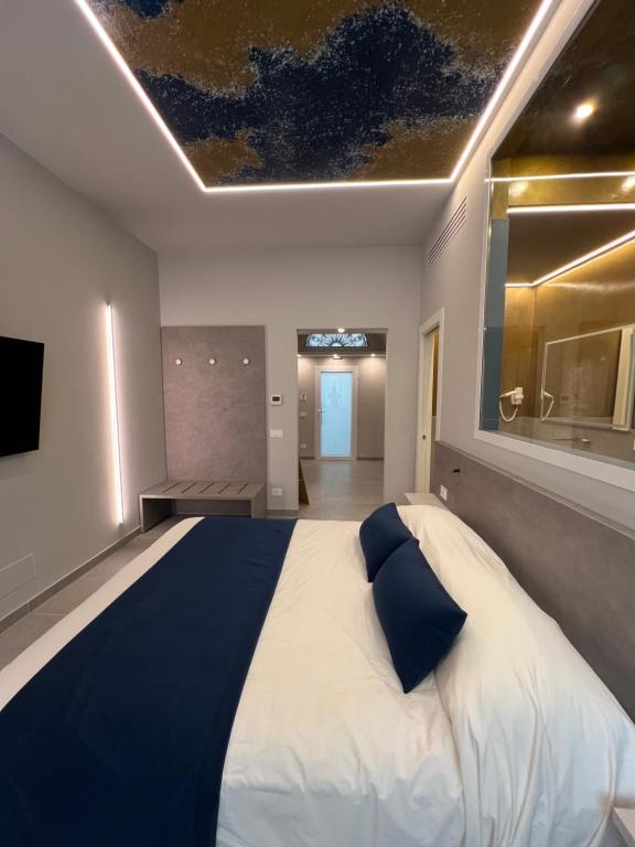 Postel nebo postele na pokoji v ubytování Shanti Rooms & Apartments Lucullo