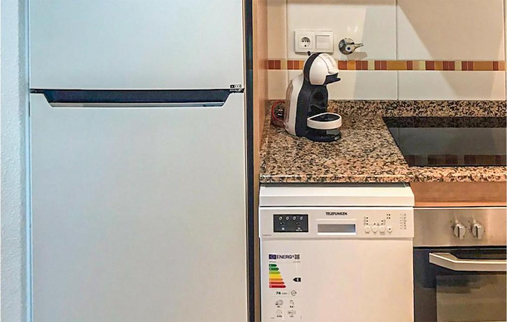 A kitchen or kitchenette at Awesome Apartment In La Torre De La Sal